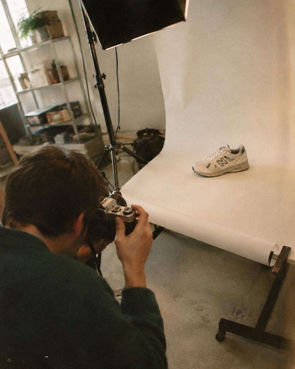 A portrait session in progress, the photographer shooting by a window